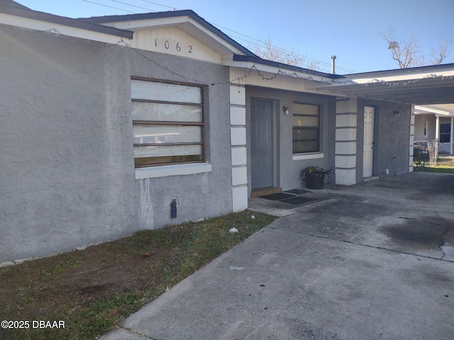 view of property exterior with stucco siding