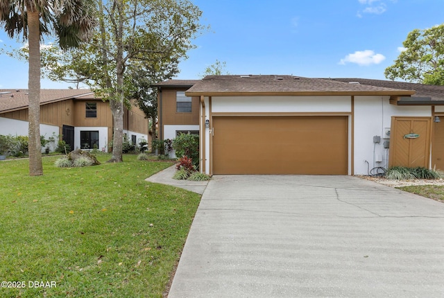7 Appaloosa Trl, Ormond Beach, FL 32174 - view of front facade featuring concrete driveway, an attached garage, a front lawn, and stucco siding
