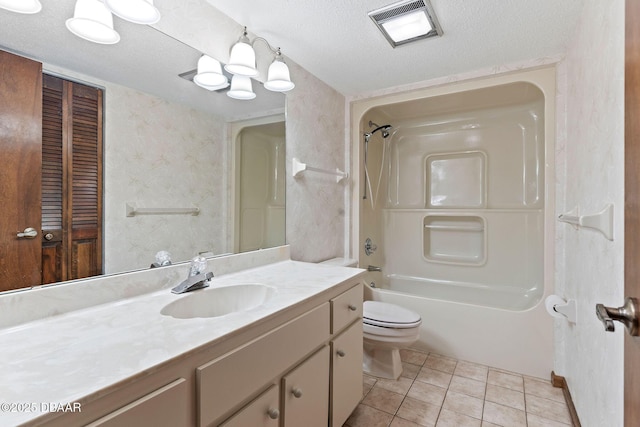 7 Appaloosa Trl, Ormond Beach, FL 32174 - full bathroom featuring vanity, toilet,  shower combination, tile patterned flooring, and a textured ceiling