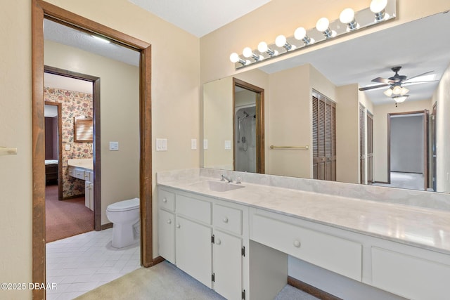 7 Appaloosa Trl, Ormond Beach, FL 32174 - ensuite bathroom featuring ceiling fan, toilet, vanity, and tile patterned floors