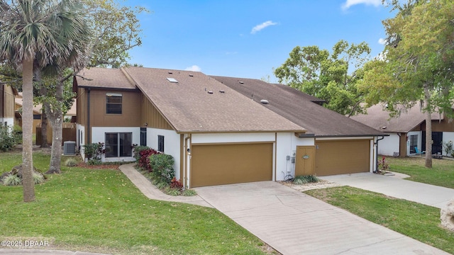7 Appaloosa Trl, Ormond Beach, FL 32174 - view of front of property with a garage, central AC unit, concrete driveway, a front yard, and roof with shingles