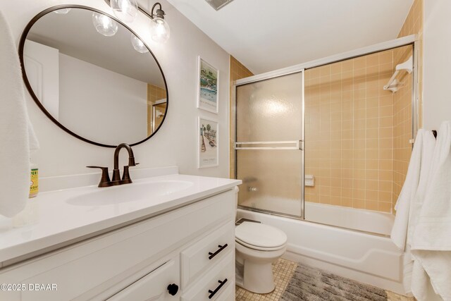 full bathroom with vanity, toilet, and enclosed tub / shower combo