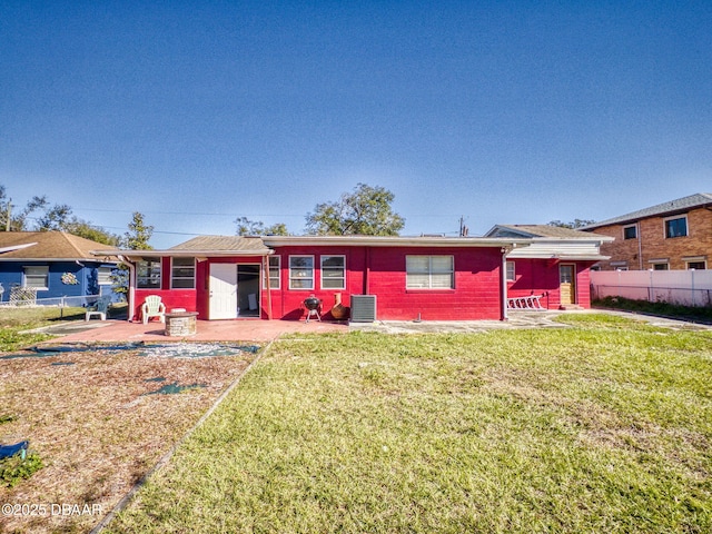 back of property featuring a patio area, central AC, and a yard