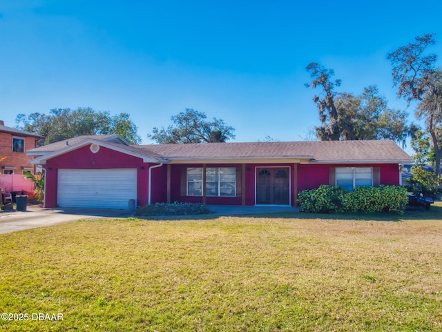 ranch-style home featuring a garage and a front lawn