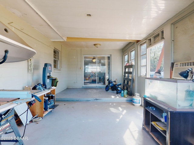 miscellaneous room featuring cooling unit and concrete flooring