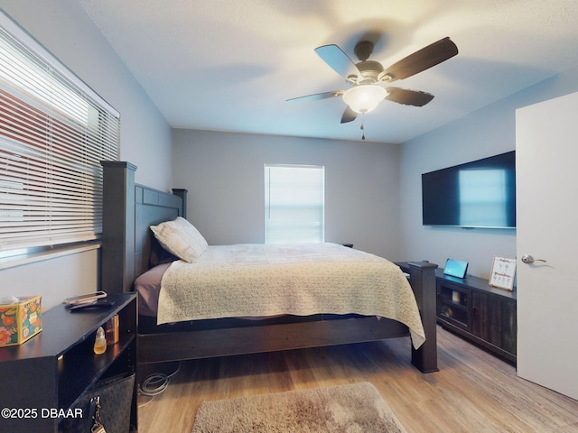 bedroom featuring ceiling fan and light hardwood / wood-style floors