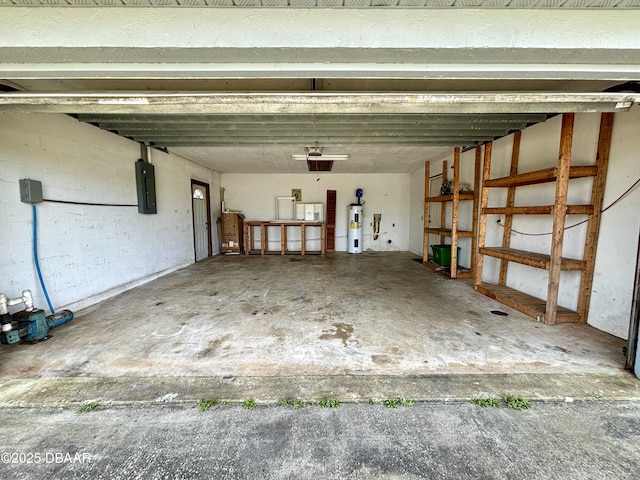 156 Riverwalk Ct, Ormond Beach, FL 32176 - garage featuring concrete block wall, electric water heater, and electric panel