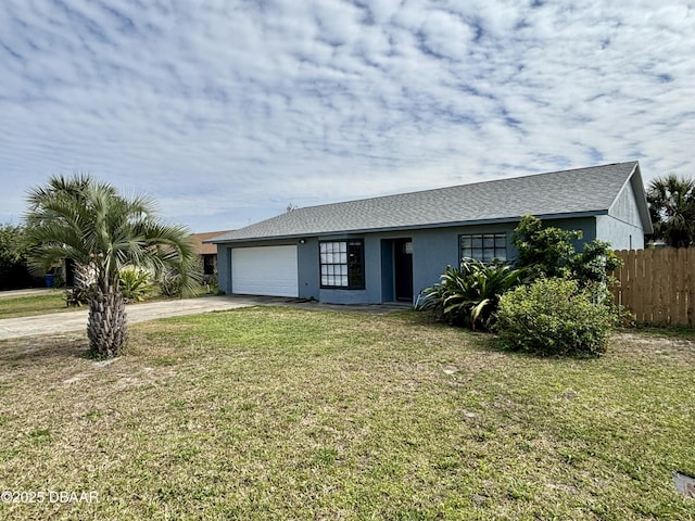 single story home featuring stucco siding, a front yard, fence, a garage, and driveway