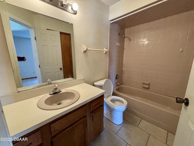 full bath with  shower combination, vanity, tile patterned flooring, and toilet