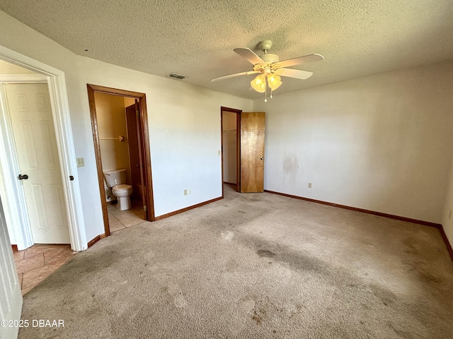 156 Riverwalk Ct, Ormond Beach, FL 32176 - unfurnished bedroom with baseboards, carpet flooring, a textured ceiling, and visible vents