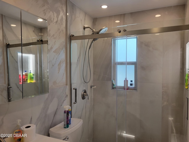 1956 Linda Ave, Ormond Beach, FL 32174 - bathroom featuring a shower stall, toilet, tile walls, and recessed lighting