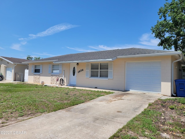 1956 Linda Ave, Ormond Beach, FL 32174 - single story home featuring concrete block siding, an attached garage, a shingled roof, a front lawn, and driveway