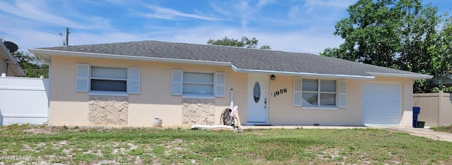 1956 Linda Ave, Ormond Beach, FL 32174 - view of front of house featuring roof with shingles, a garage, and concrete block siding