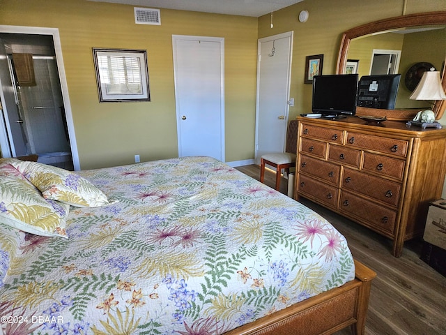 bedroom featuring dark wood-type flooring