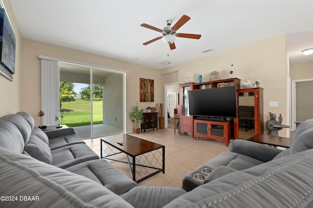 living room with ceiling fan and light tile patterned floors