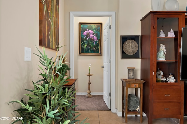 hallway featuring light tile patterned floors