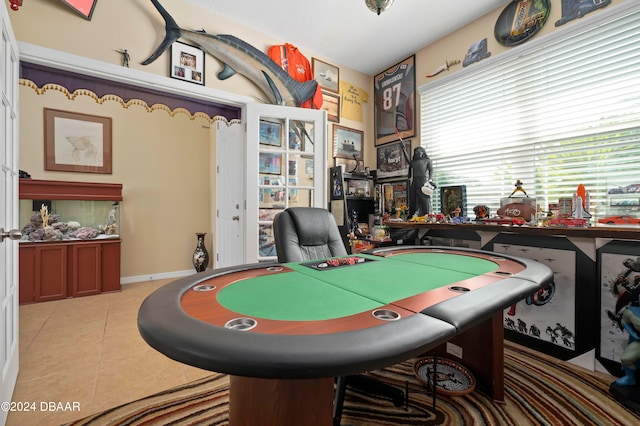 recreation room with light tile patterned flooring