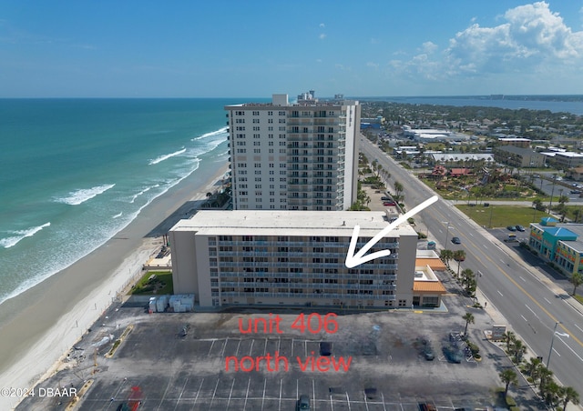 bird's eye view featuring a view of the beach and a water view