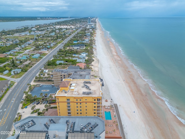 aerial view featuring a view of the beach and a water view