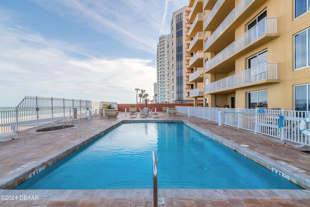 view of pool featuring a patio area