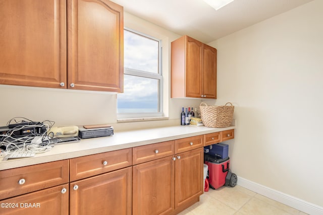 kitchen with light tile patterned flooring