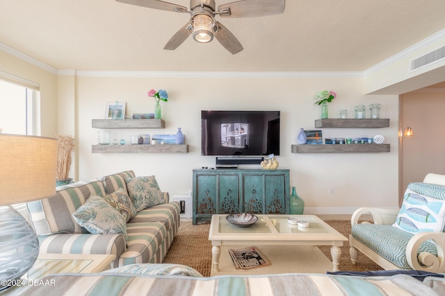 living room with ornamental molding and ceiling fan