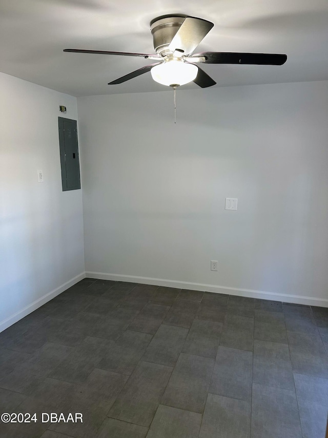 empty room with electric panel and ceiling fan