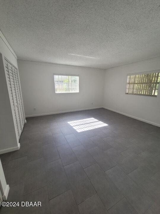 empty room with a textured ceiling