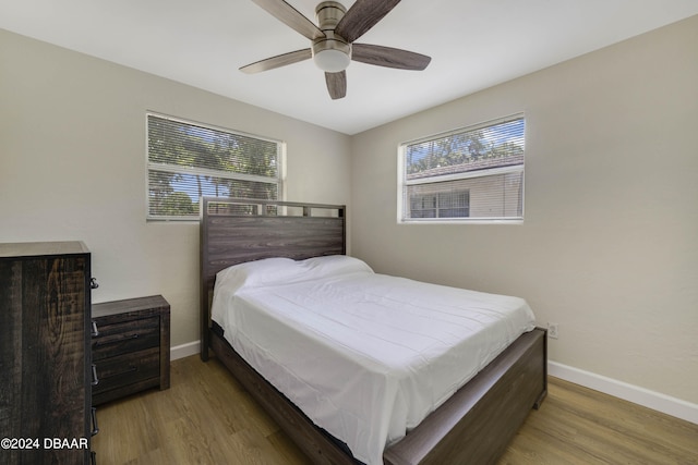 bedroom with hardwood / wood-style flooring and ceiling fan