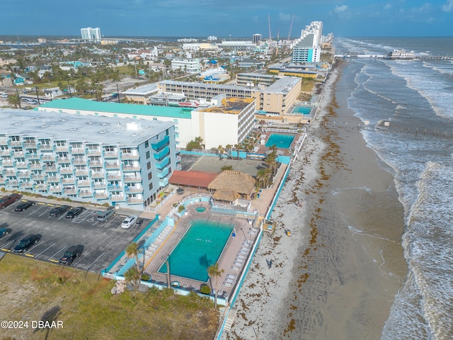 aerial view featuring a view of the beach and a water view