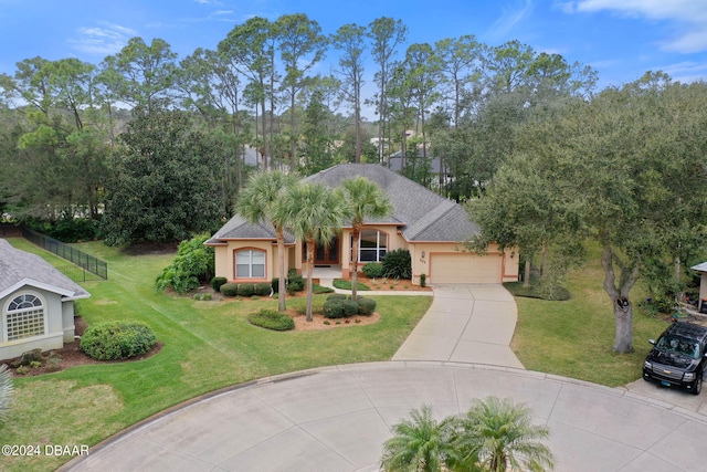 view of front of home featuring a garage and a front yard