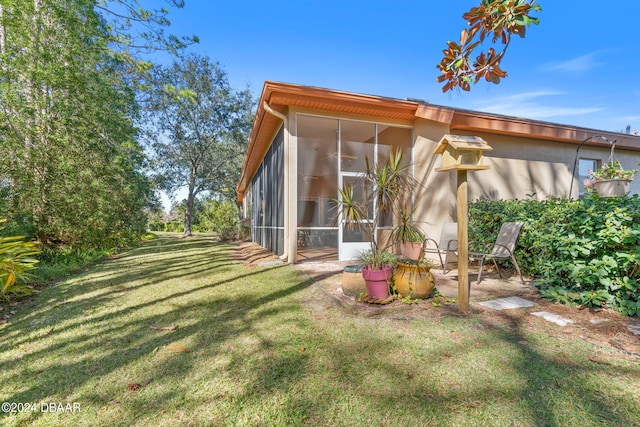 view of yard featuring a sunroom