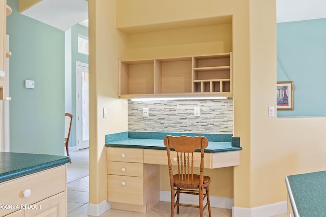 tiled home office featuring built in desk