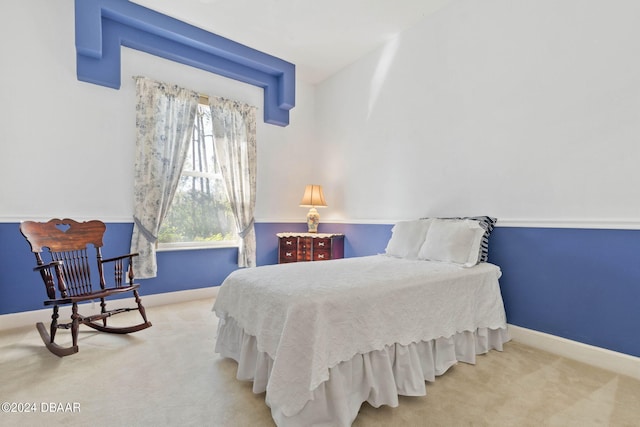 bedroom with lofted ceiling and carpet floors