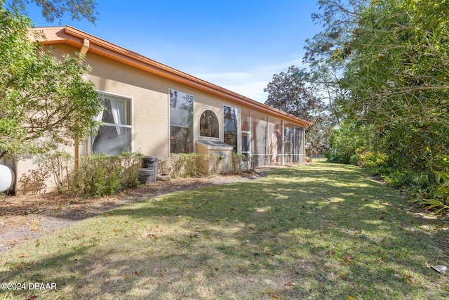 view of yard with a sunroom