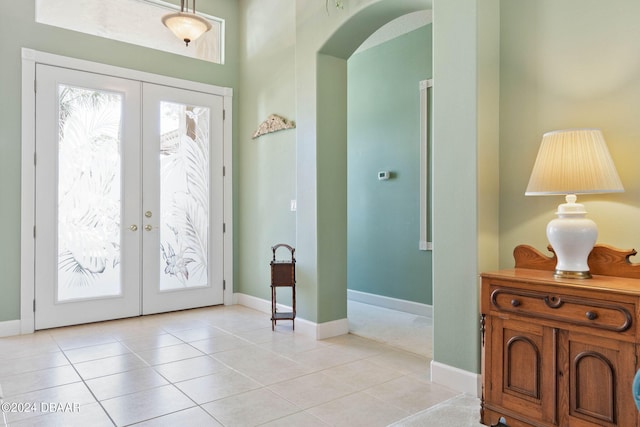 tiled foyer entrance featuring french doors