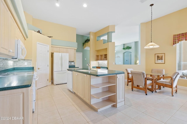 kitchen with sink, light tile patterned floors, backsplash, hanging light fixtures, and white appliances