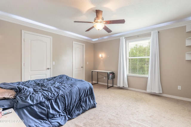 carpeted bedroom featuring ornamental molding, a textured ceiling, and ceiling fan