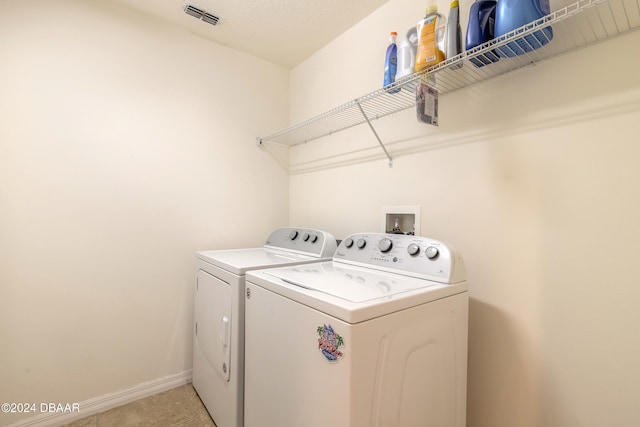 laundry area with separate washer and dryer