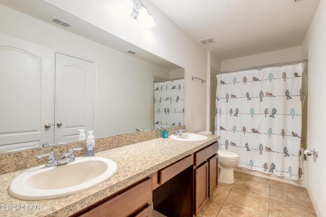206 Laurel Point Ct, Deland, FL 32724 - bathroom with toilet, double vanity, tile patterned flooring, and a shower with shower curtain