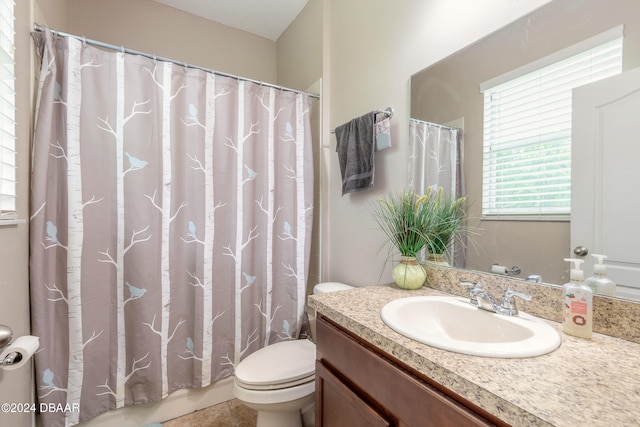 bathroom with vanity, tile patterned floors, and toilet