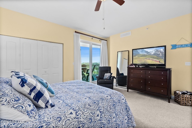 carpeted bedroom with ceiling fan, access to exterior, and a closet