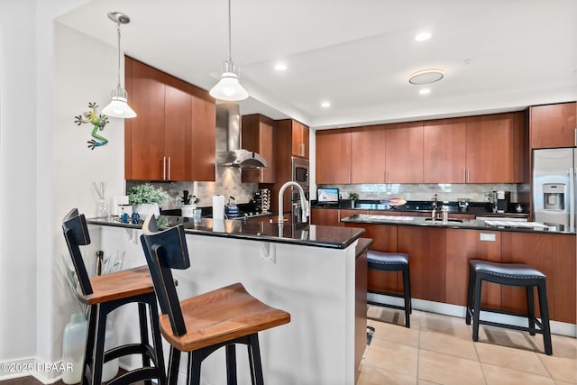 1925 S Atlantic Ave Unit 811, Daytona Beach Shores, FL 32118 - kitchen with wall chimney range hood, a peninsula, dark countertops, decorative backsplash, and recessed lighting