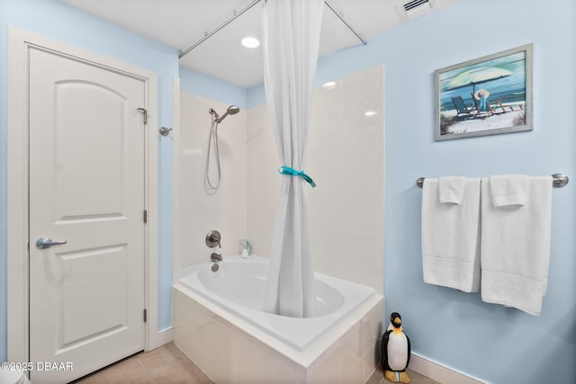 bathroom featuring shower / bathtub combination with curtain and tile patterned flooring