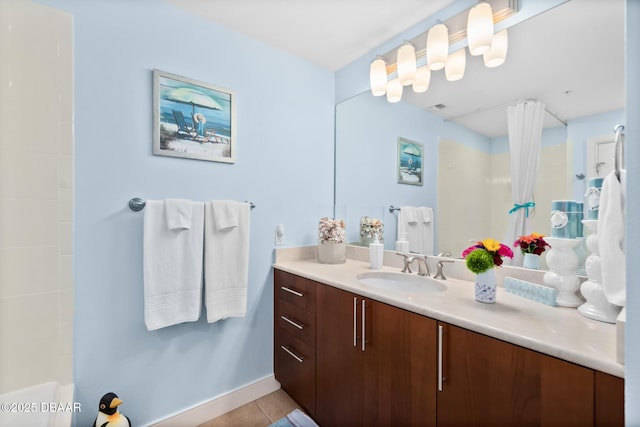 bathroom featuring walk in shower, tile patterned floors, and vanity