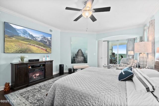 bedroom with access to outside, ornamental molding, and wood-type flooring