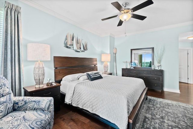 bedroom with dark hardwood / wood-style flooring, ornamental molding, and ceiling fan