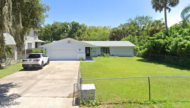 223 Clark Pl, Port Orange, FL 32127 - single story home with a front yard, fence private yard, driveway, and a garage