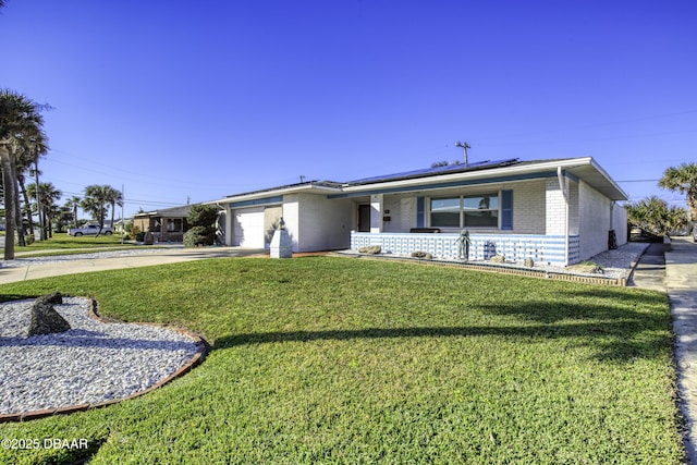 ranch-style house with a front yard and a garage