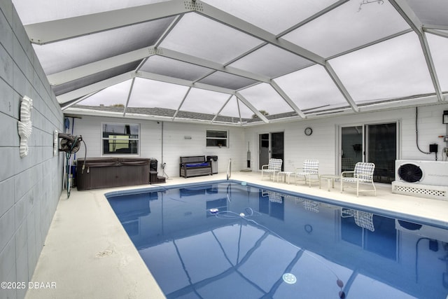 view of swimming pool featuring a lanai, ac unit, a hot tub, and a patio